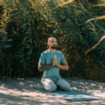 man meditating outside