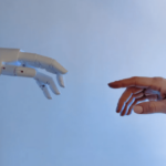 Artificial intelligence hand touching a human hand