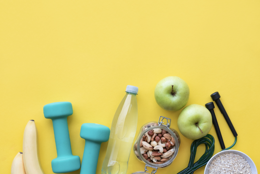 Image of healthy items: apple, banana, weights
