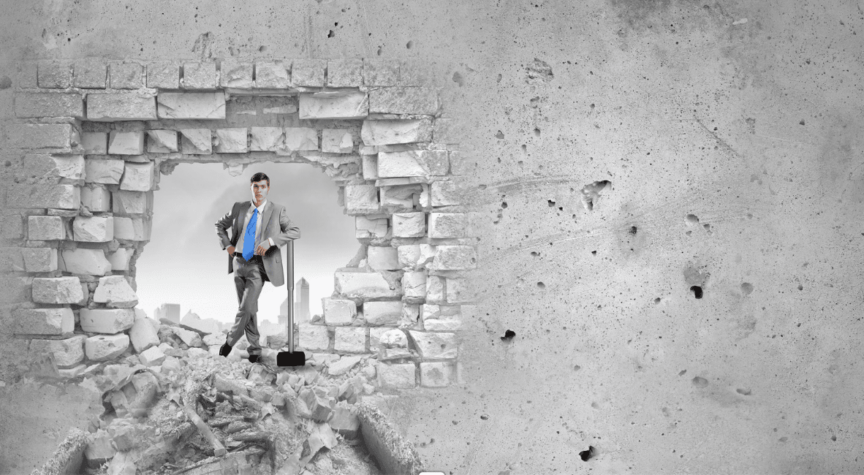 Business Man with sledge hammer and brick wall broke through for overcoming business challenges
