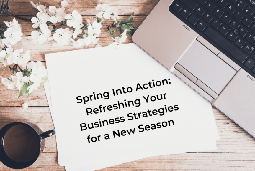 laptop, coffee, spring flowers, and paper for spring business